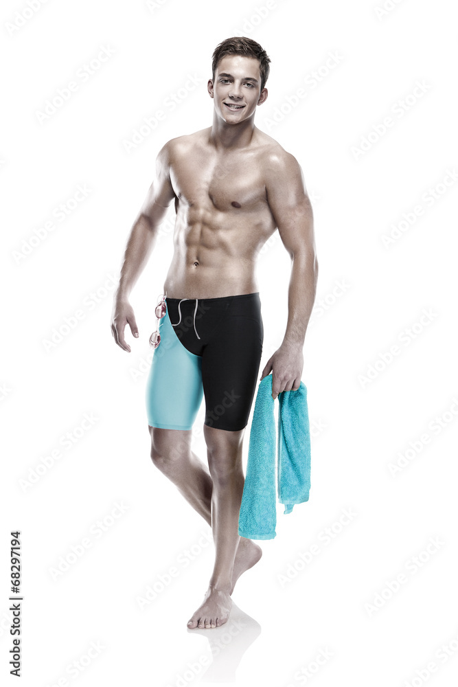 Young attractive caucasian man swimmer with goggles and towel Young attractive caucasian man swimmer with goggles and towel