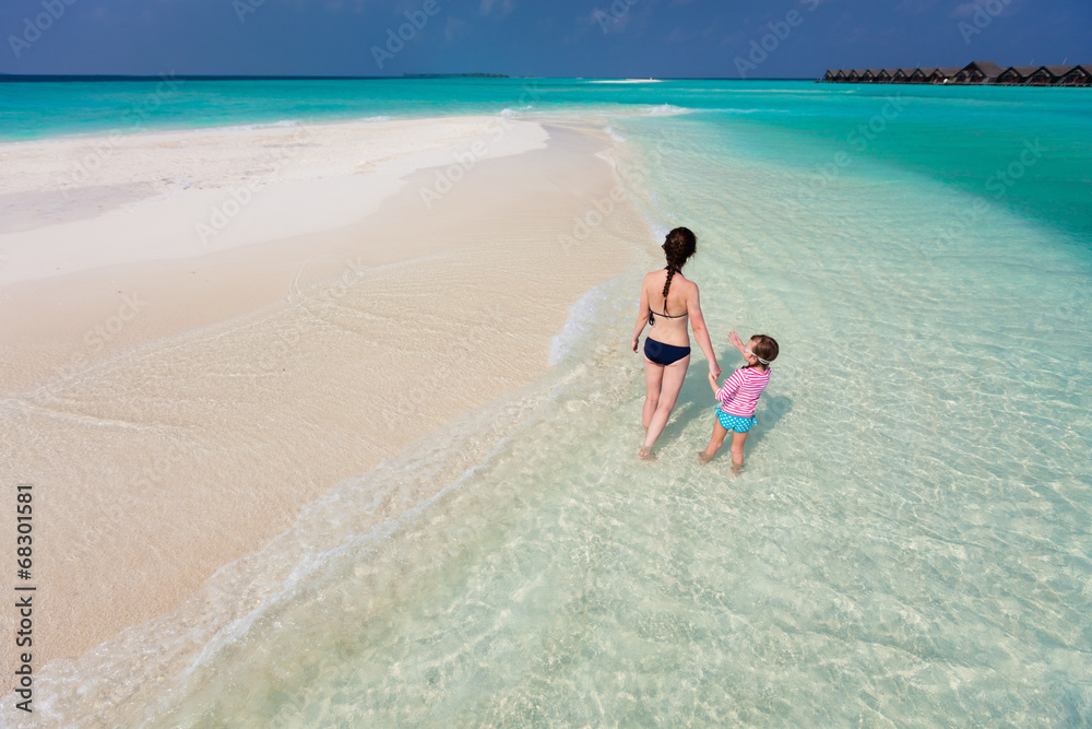 Mother and daughter at tropical beach