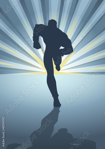 Silhouette of a male figure running in front of light burst