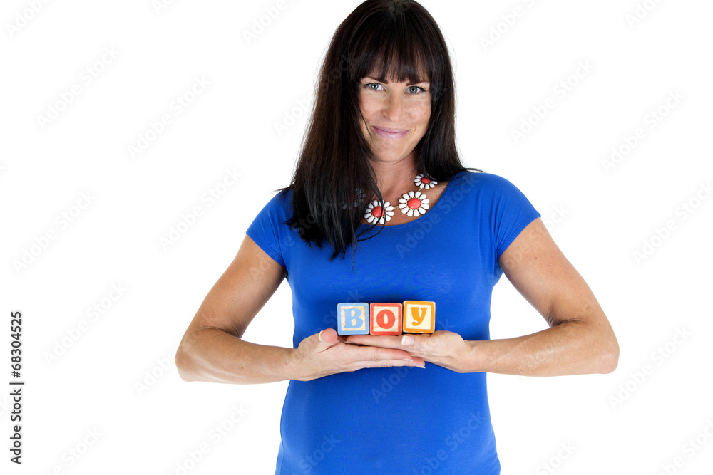 Pregnant mother holding wooden blocks spelling out boy Pregnant mother holding wooden blocks spelling out boy