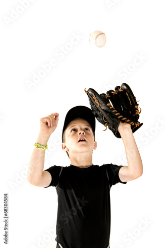 Photography Young boy baseball player focusing on catching the ball