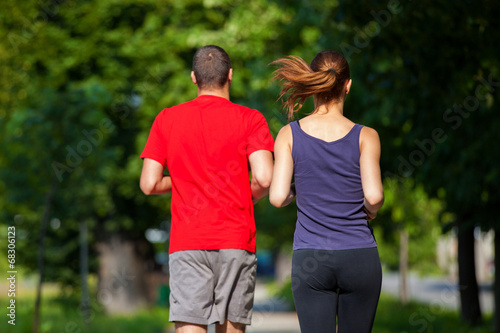 Fototapeta Naklejka Na Ścianę i Meble -  Young running couple jogging