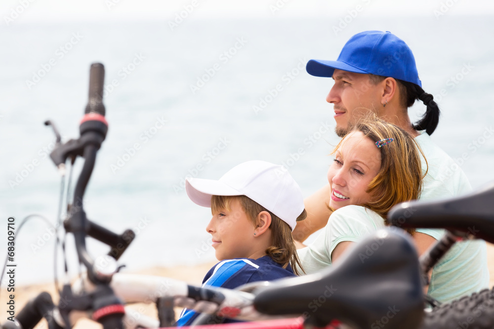 Smiling parents with teenager having rest