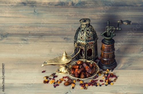 Raisins and dates. Vintage oriental lantern and mill