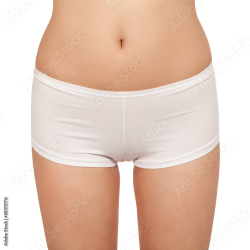 Fotografie Female body in underwear isolated on white