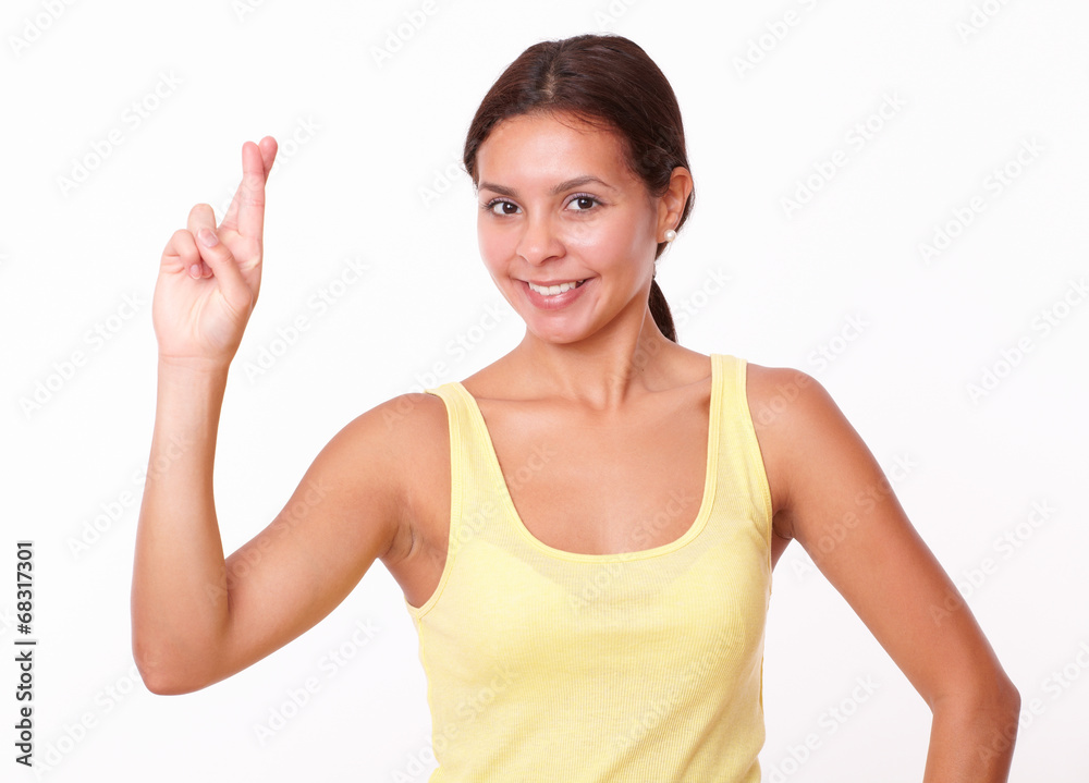 Cute latin girl with luck sign
