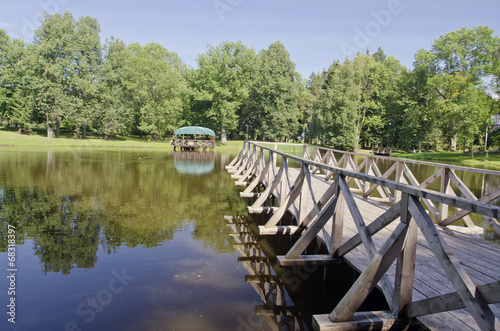 wooden bridge on pond water