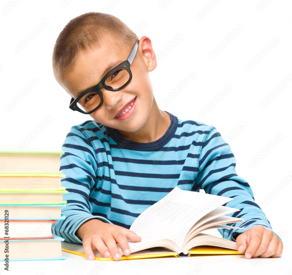 Little boy is reading a book Little boy is reading a book