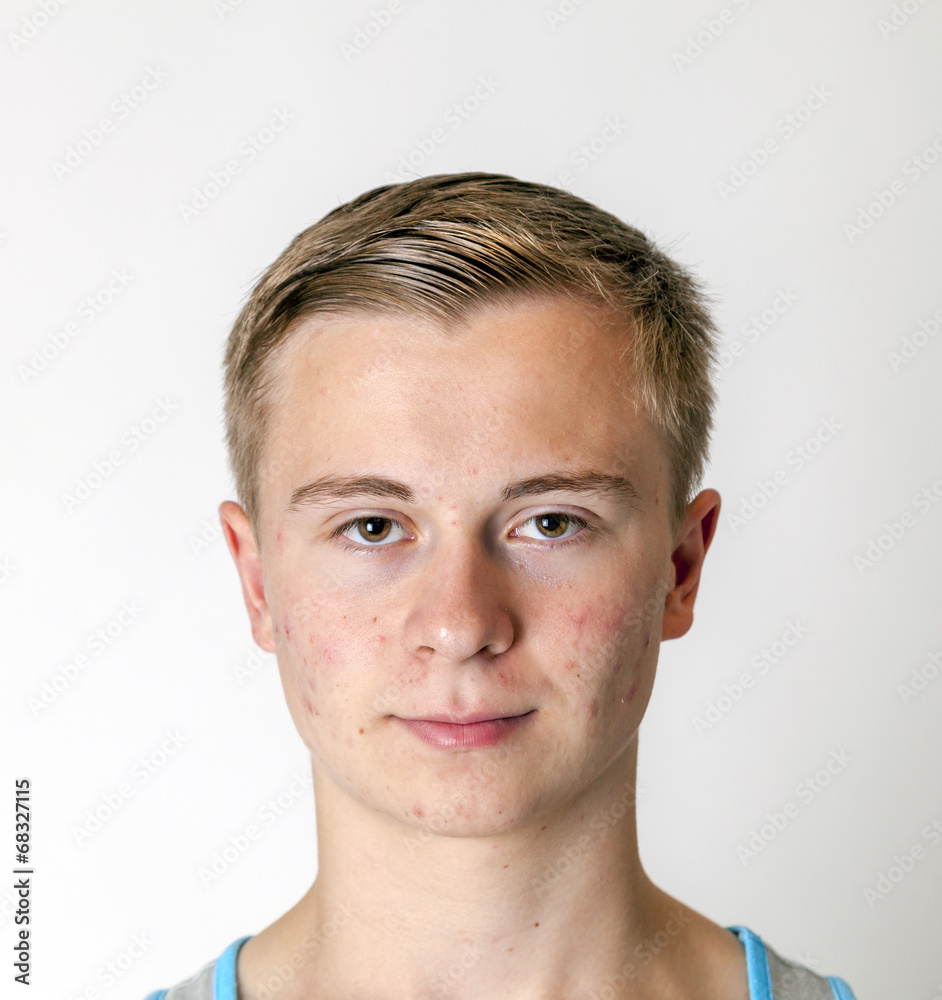 Obraz premium Portrait of a positive adolescent boy in puberty