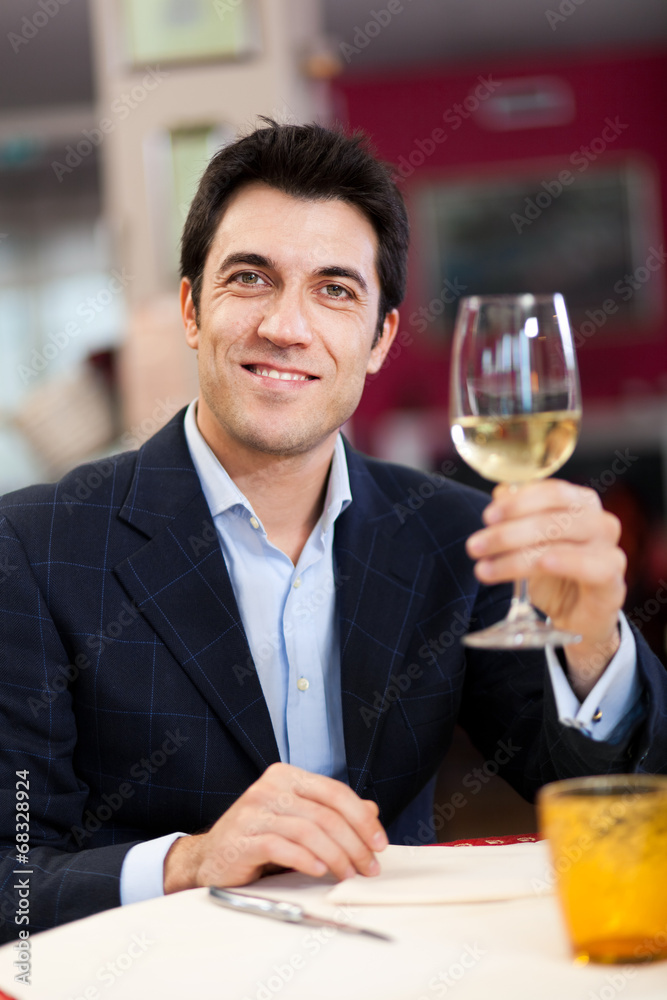 Man drinking wine at the restaurant Man drinking wine at the restaurant