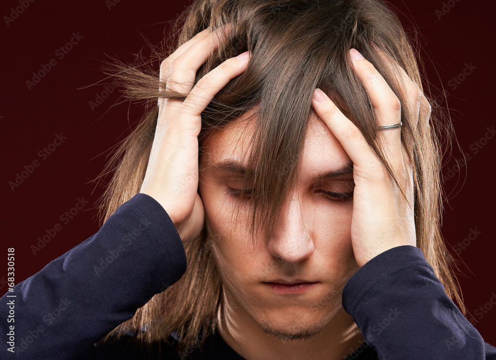 Portrait of sick man having a migraine Portrait of sick man having a migraine