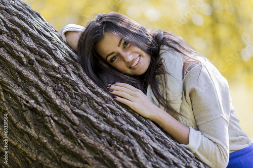 Young woman in autumn forest