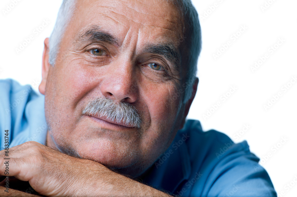 Fototapeta premium Eldery man with head resting on arms