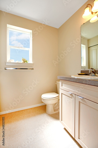 Creamy warm bathroom interior
