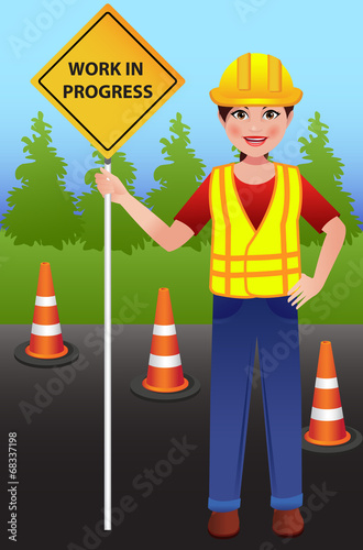 Road construction worker women with Work in Progress board