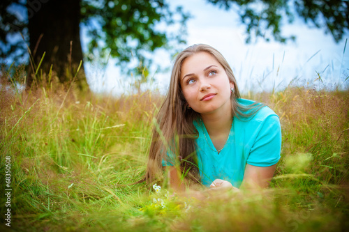 beautiful young brunette woman on the meadow © Andriy Petrenko
