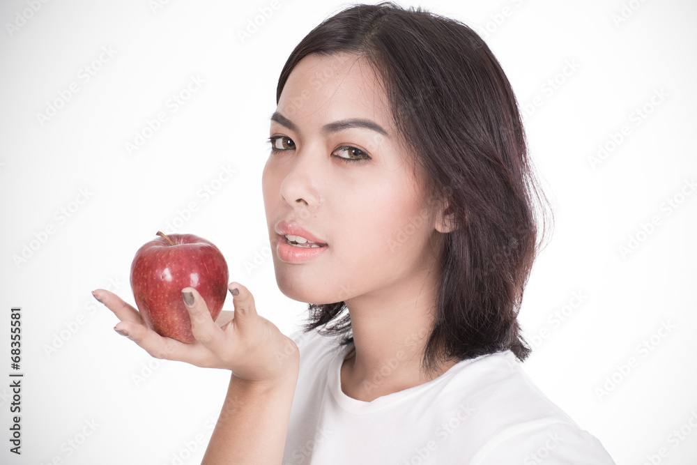 Smiling woman with apple isolated on white Smiling woman with apple isolated on white