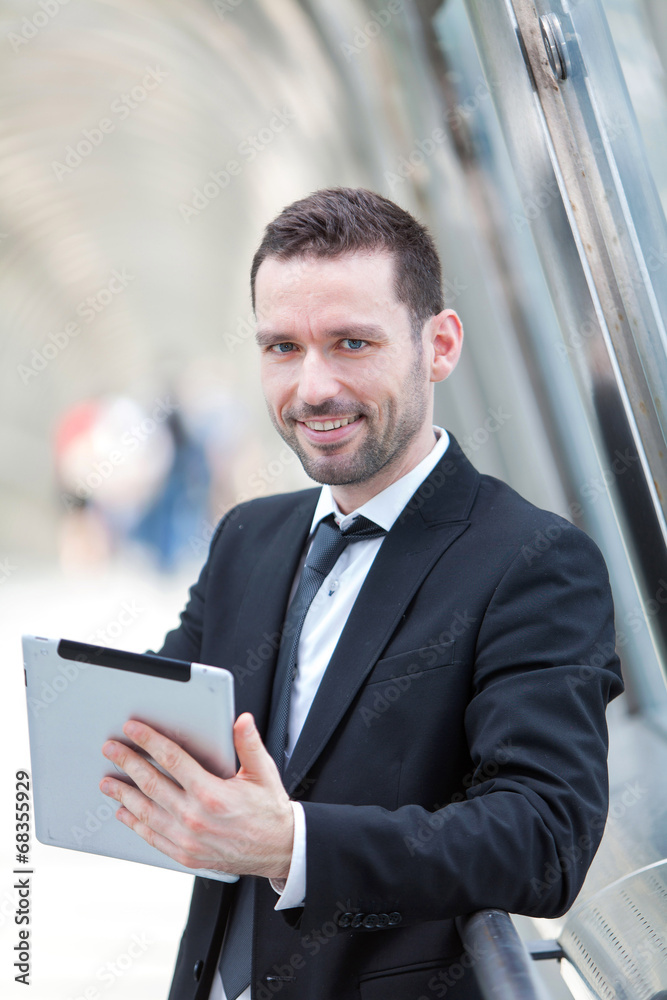 Portrait of an attractive businessman using a tablet Portrait of an attractive businessman using a tablet