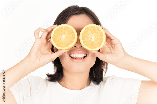 Young woman holding fresh oranges. Healthy eating. Isolated over