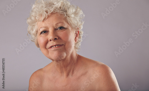 Confident old woman with smile on her face