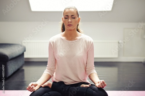 Fit young woman in meditation Free Download Fit young woman in meditation - GFXLoad