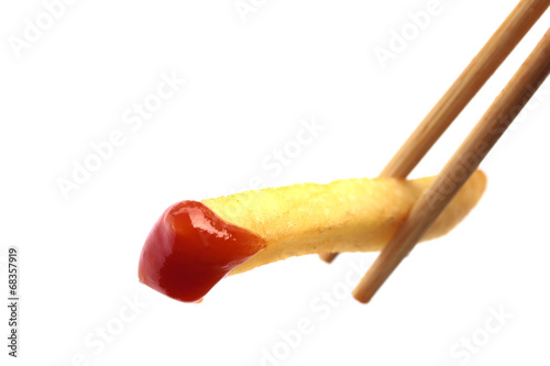 Close up image of dipping fried potato on white background
