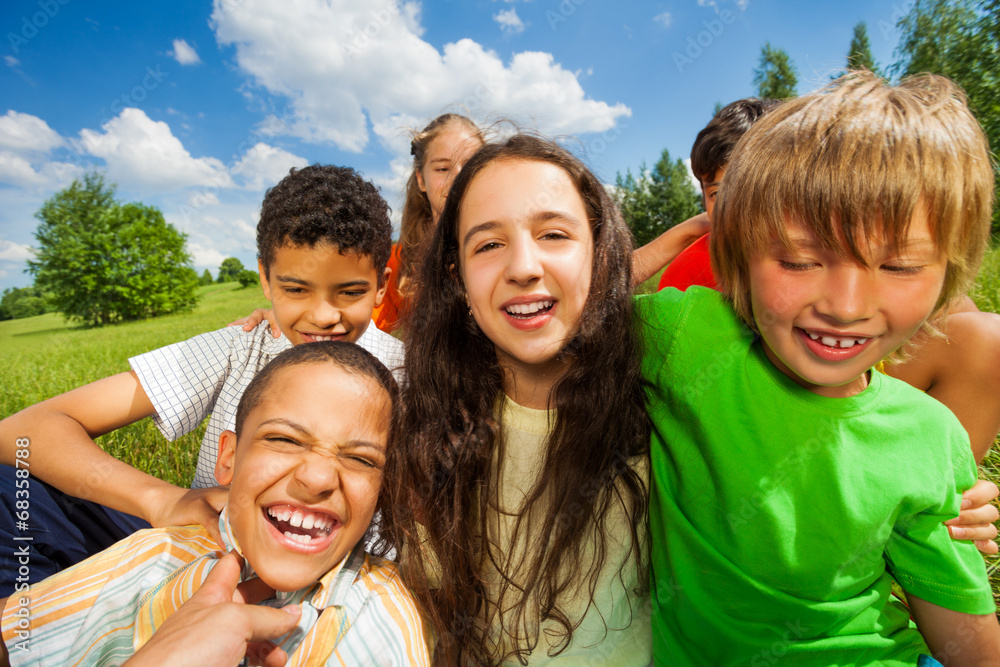 Close up view of excited kids in a group together Close up view of excited kids in a group together