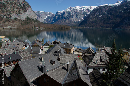 Village with lake and Alps range background