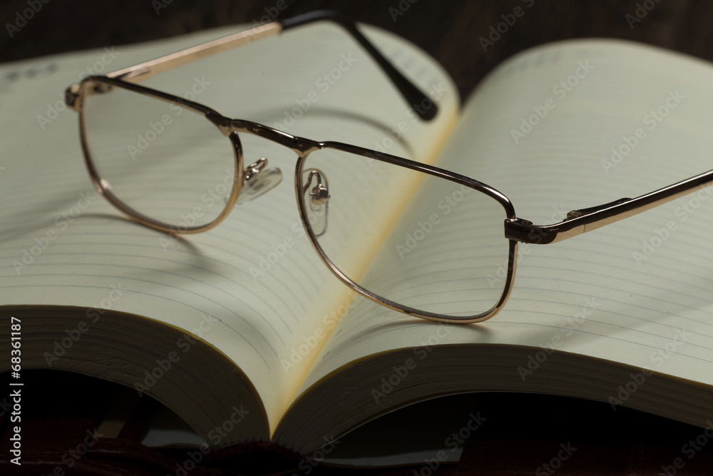 Notepad and glasses Notepad and glasses