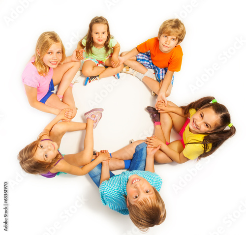 Six children holding hands photo