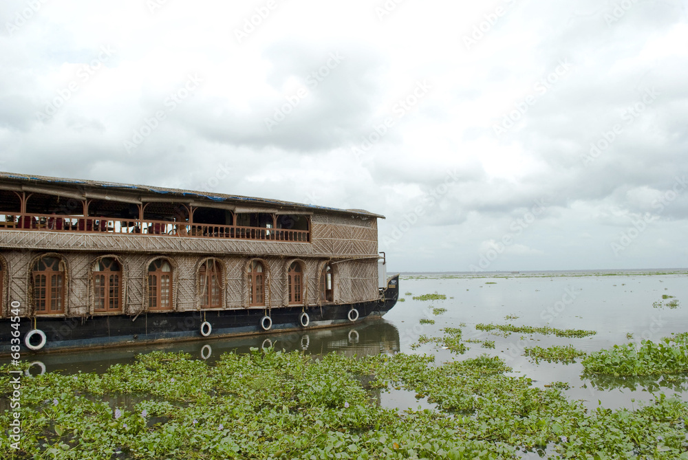 Houseboat in Backwaters, Kerala on a cloudy day Houseboat in Backwaters, Kerala on a cloudy day