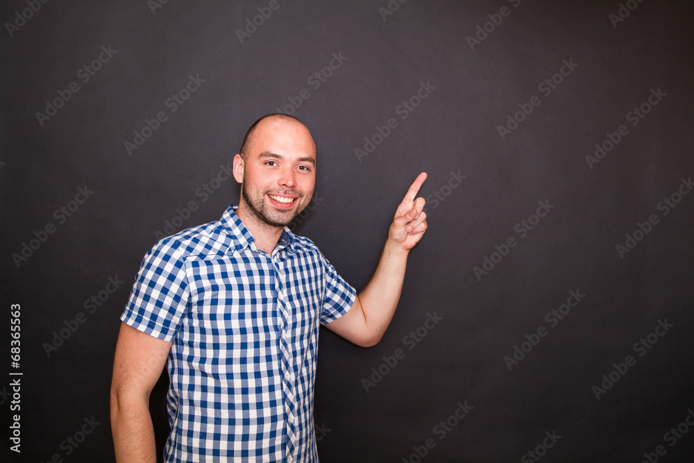 Young man pointing his finger Young man pointing his finger