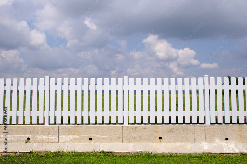 New white fence with with concrete base New white fence with with concrete base