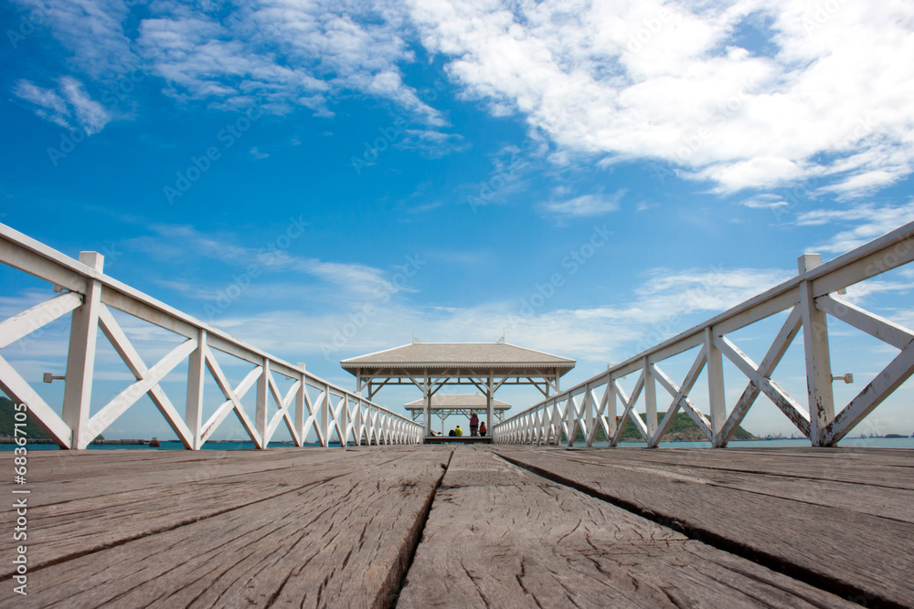white wooden bridge in waterfront pavilion at the sea