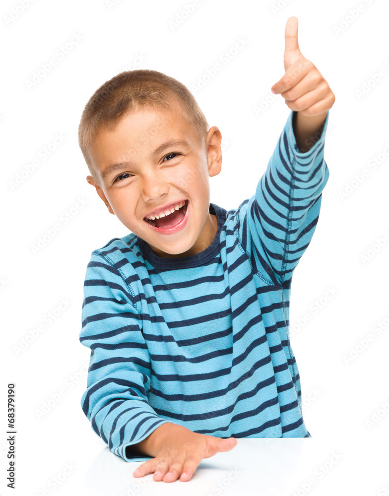 Little boy is showing thumb up sign Little boy is showing thumb up sign