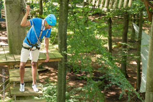 Man is afraid of heights at high rope court