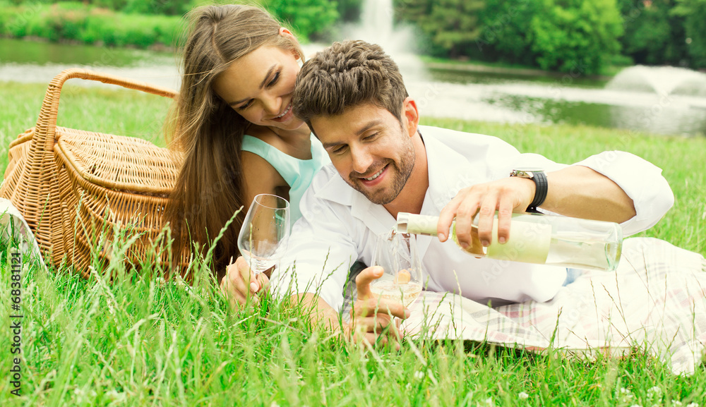 Young couple on date drinking white wine Young couple on date drinking white wine