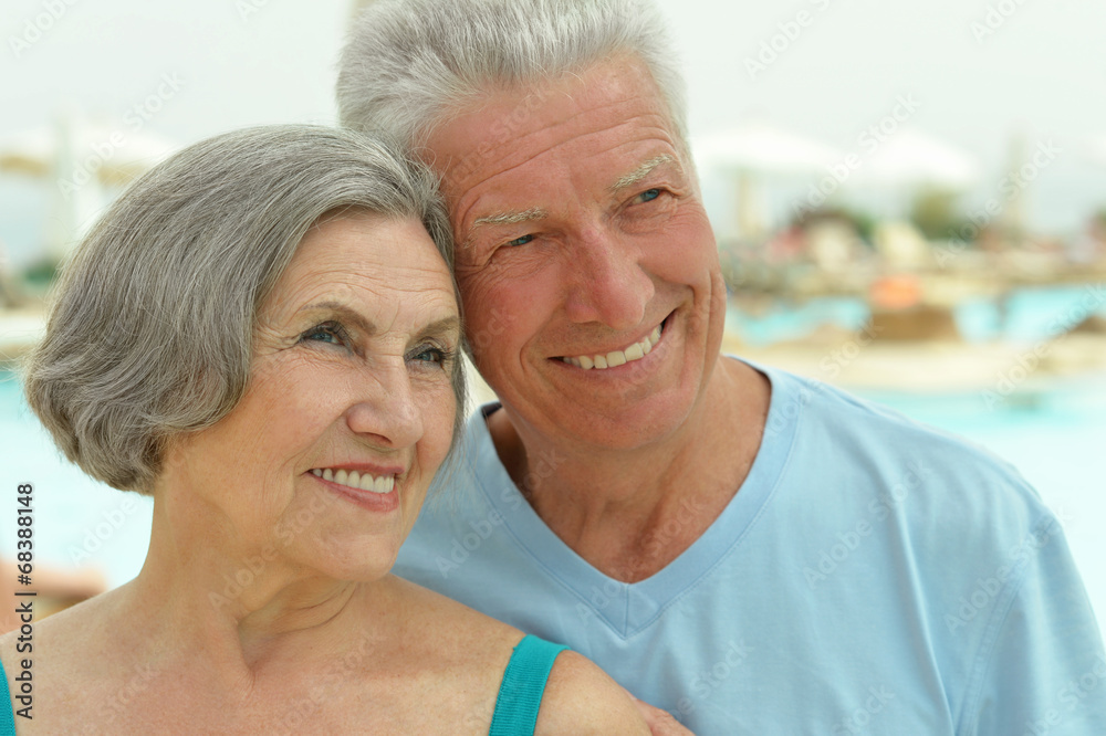 Senior couple by pool Senior couple by pool