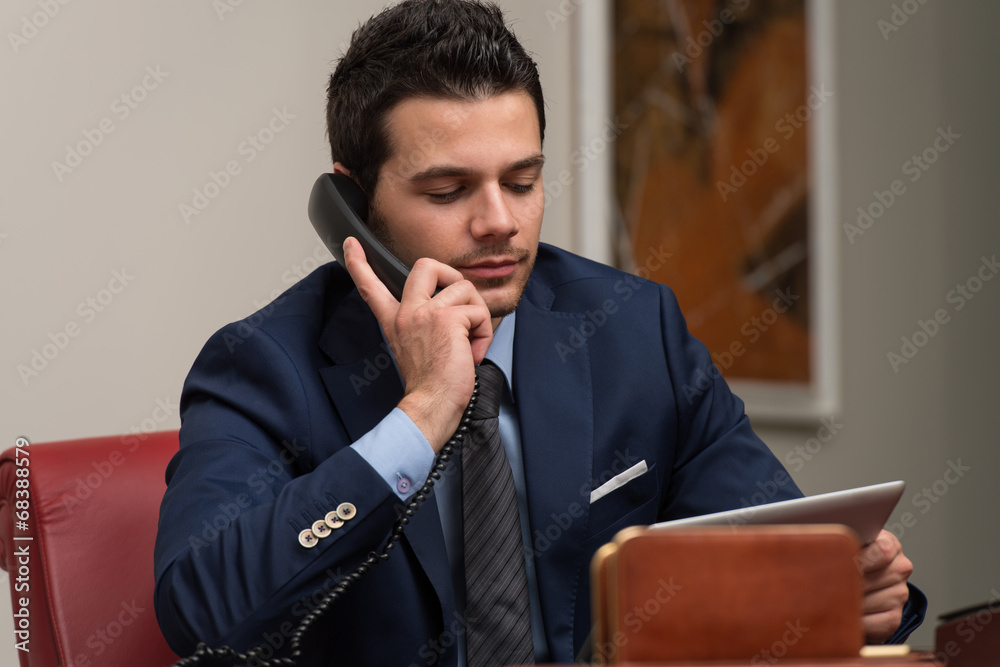 Businessman Talking On Telephone In Office Businessman Talking On Telephone In Office