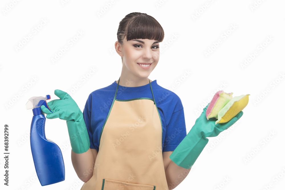 Housekeeping Concept: Young caucasian Housewife With Sponges and Housekeeping Concept: Young caucasian Housewife With Sponges and