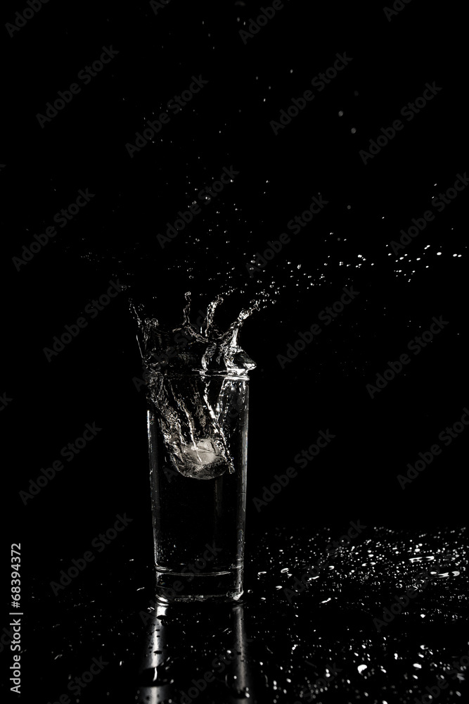 Water splashing out of a glass