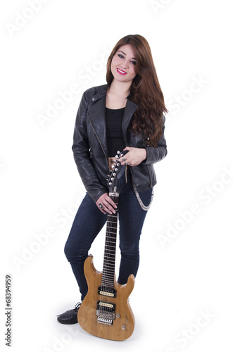 Beautiful sexy young musician girl holding electric guitar