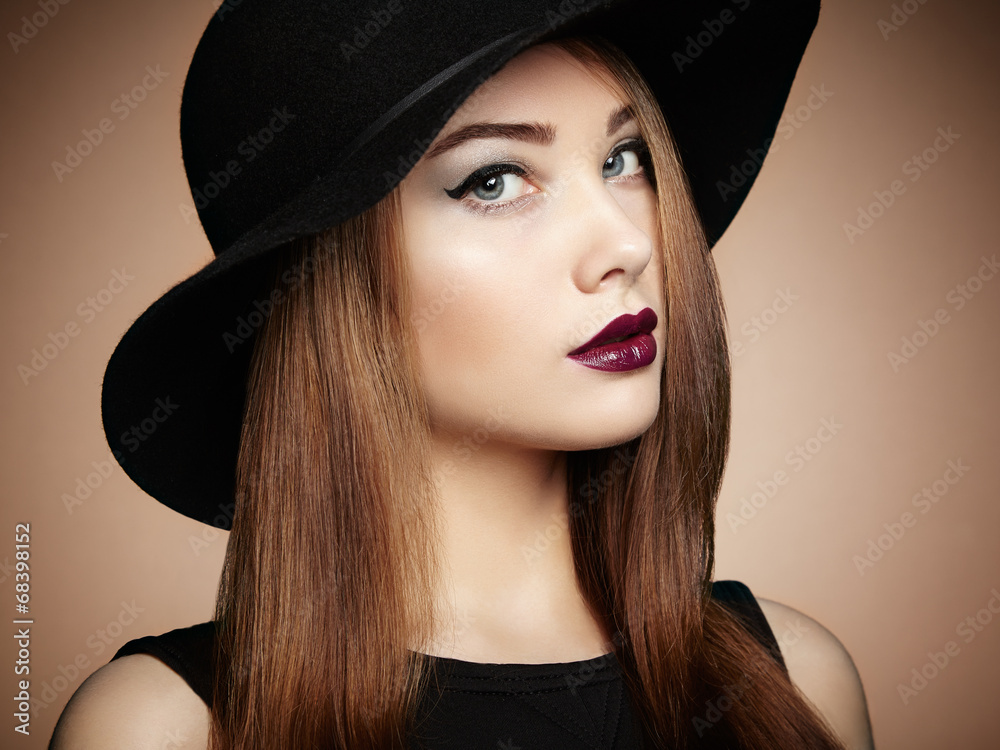 Fashion photo of young magnificent woman in hat. Girl posing Fashion photo of young magnificent woman in hat. Girl posing