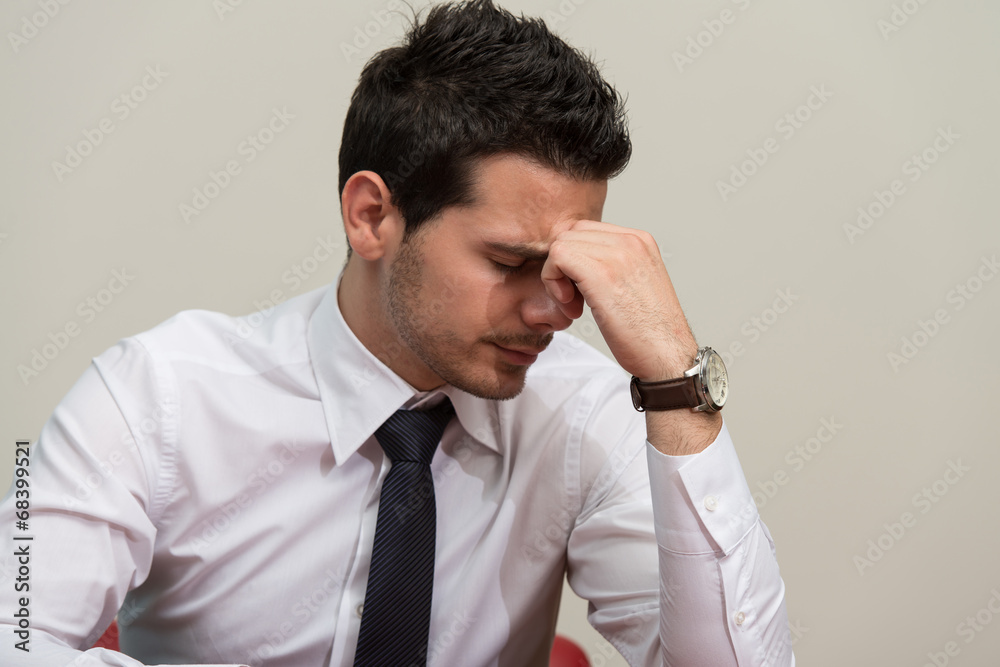Young Business Man With Problems In The Office Young Business Man With Problems In The Office