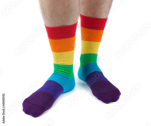 Mens hairy legs in colored striped socks fun. Isolate