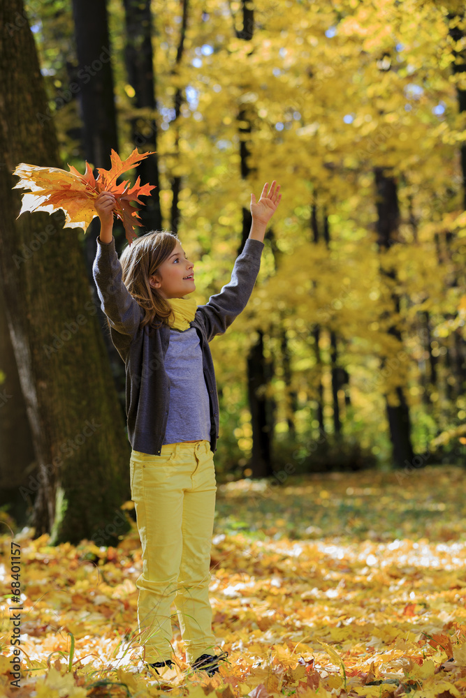Autumn fun - lovely girl has a fun in autumn park Autumn fun - lovely girl has a fun in autumn park