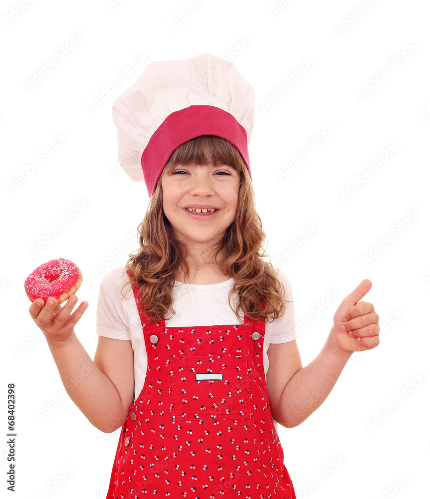 happy little girl cook with donuts and thumb up happy little girl cook with donuts and thumb up