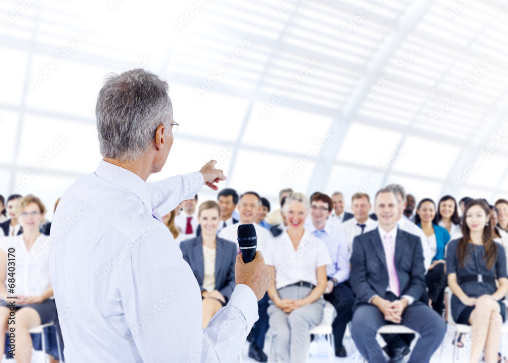 Businessman giving presentation to his Colleagues Businessman giving presentation to his Colleagues