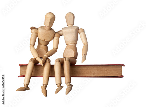 Consolation of a friend depicted by two figurines on a book