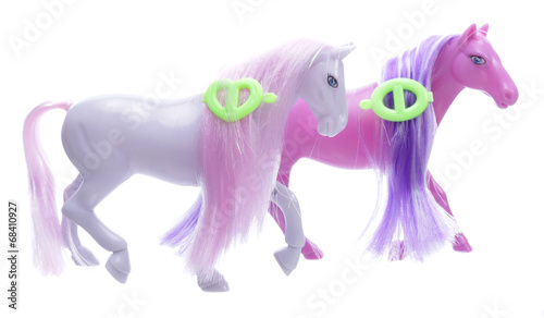 Two toy little ponies isolated on white background